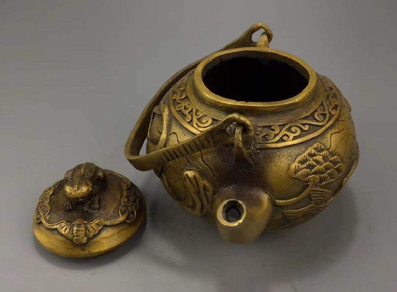 An aged copper teapot