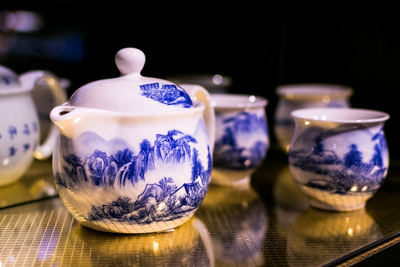 The glazed blue and white porcelain teapot