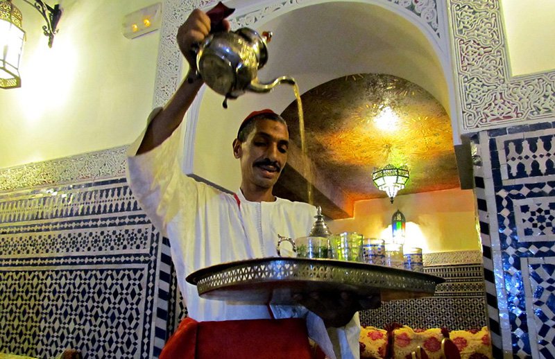 High pour tea with a Moroccan copper teapot