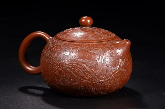 Full-handmade Zisha teapot made by a master usually has a delicate carving