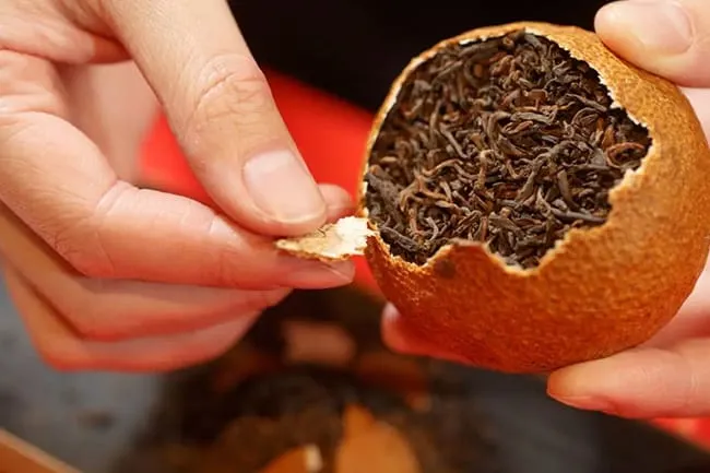 For the big tangerine Pu-erh tea, you need to break it into pieces to brewing